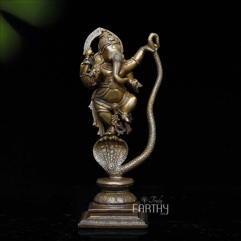 brass ganesha on snake